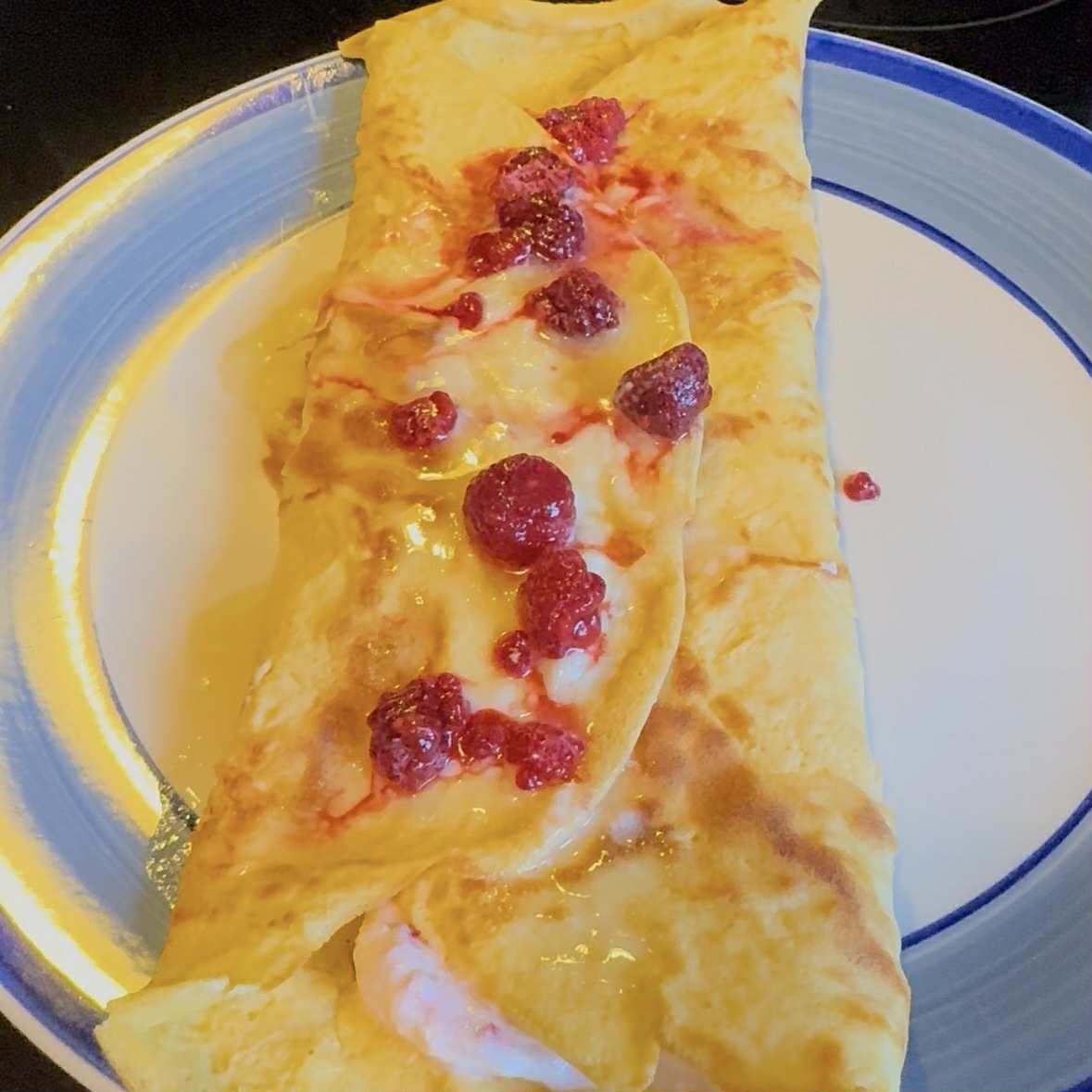 Zero-Carb Protein Crepes topped with Raspberries and Syrup